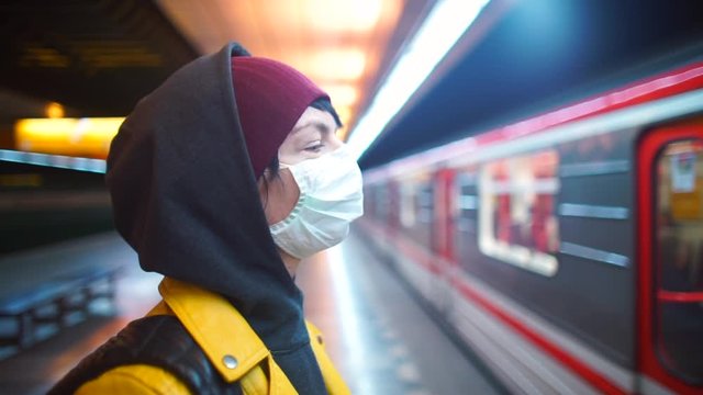 A volunteer in a medical mask looks at the train cars. Restriction of movement around the city. State of emergency. coronavirus infection COVID-19 Pondemic in Europe.