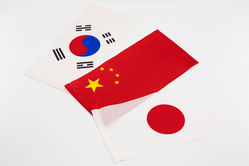 Three flags on a white background.
