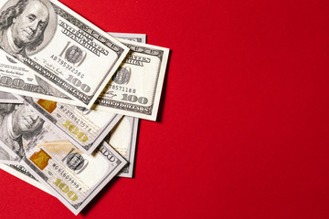 money isolated on red background