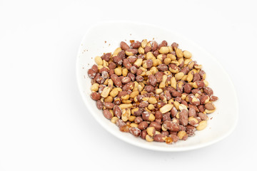 Fried Salty Peanut served in the white bowl above white background
