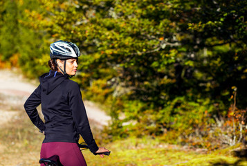 Female cyclist enjoying ride in nature