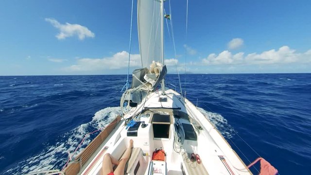 First-person view of yacht's prow in the blue sea water