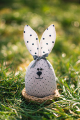 Little rabbit in green grass. Easter bunny. Easter holiday concept.