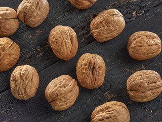 Walnuts lie on a light colored background