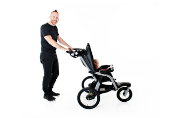 Fototapeta na wymiar A father jogging with a baby stroller