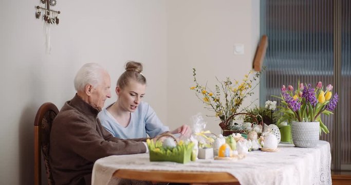 Woman Spending Time with Grandfather