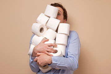 Caucasian man stocking up toilet paper at home