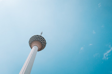 TV Tower  tower against a clear blue sky bottom view. Postcard with a spacious background from the capital of Malaysia