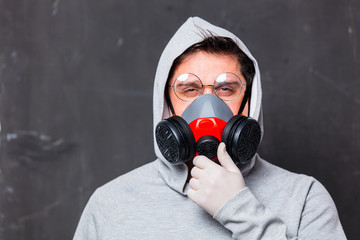 Style man in face mask and glasses on dark background