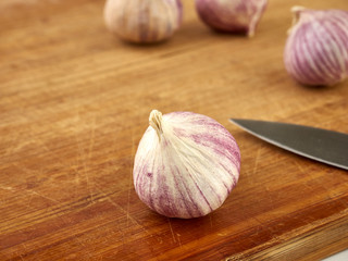 Ripe garlic lies on a wooden blue background.Healthy food.Spices