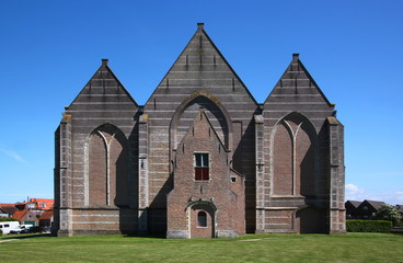 Brick facade with blind arches at the late gothic hall church in Brouwershaven city in the Netherlands