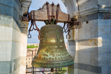 Fototapeta premium Old Pisa tower bell in sun beams. The top of famous Pisa tower. Toscana, Italy.