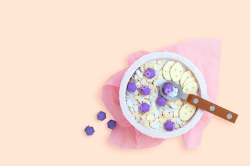 Oatmeal with blueberries and banana is made of paper