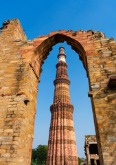 India, Delhi, New Delhi - 9 January 2020 - The Qutb minar stands in an arch