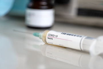 Concept of Vaccine for COVID-19. Syringe injection for immunization and treatment of coronavirus infection. 