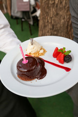 chocolate cake with cream and strawberries