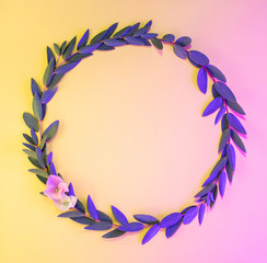 Fototapeta na wymiar Light neon background with leaves. Glowing abstract backdrop with frame with petals and space for text. Exotic nature branch with pink and yellow vivid colors. Organic twigs with shiny backlight