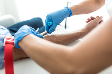 Senior man having a blood test done by a nurse © lightpoet