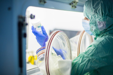 Virus antidote being prepared in a biochem lab with extremely strict precautionary measures...