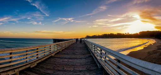 Panorama of Pier, Perspective at Sunset at Beach