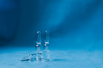 Vials to syringes at a hospital table, Hepatitis vaccine in clear vial. Immunization and treatment COVID 19 or corona virus infection(novel corona virus )from Wuhan. Pandemic and vaccination concept