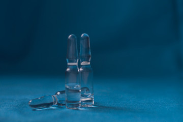 Vials to syringes at a hospital table, Hepatitis vaccine in clear vial. Immunization and treatment COVID 19 or corona virus infection(novel corona virus )from Wuhan. Pandemic and vaccination concept