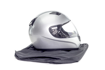 New silver motorcycle helmet on a white background close-up