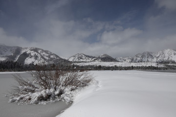 Fototapeta premium Snow and Ice at Kiva Beach and Taylor Creek Marsh Below Mount Tallac