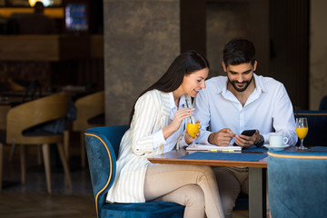 Working in a cafe and browse through emails