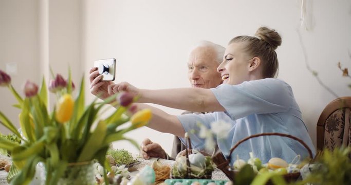 Senior Man and Woman taking Selfie Photo at Easter Holidays.