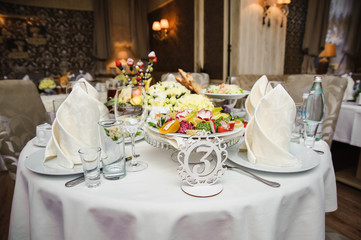 Rich banquet service. Wedding banquet. Catering food, snacks with cheese. Salad with shrimp. Different colorful meals for breakfast or lunch time. Restaurant interior
