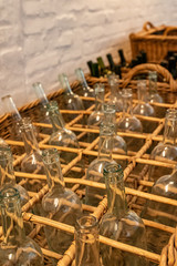 Empty clear glass bottles ready for bottling wine