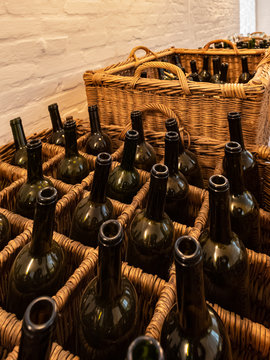 Empty dark glass bottles ready for bottling wine