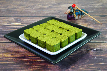 Japanese Mutcha green tea Nama chocolate is a type of ganache, made from a mix of melted cacao, Mutcha green tea powder and fresh cream and sprinkled with Mutcha green tea powder on top.Space for text