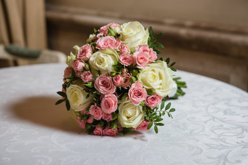 Colorful wedding bouquet on a table. Bridal bouquet. Luxury royal hotel. Valentine's day, birthday, dating or mother's day decoration