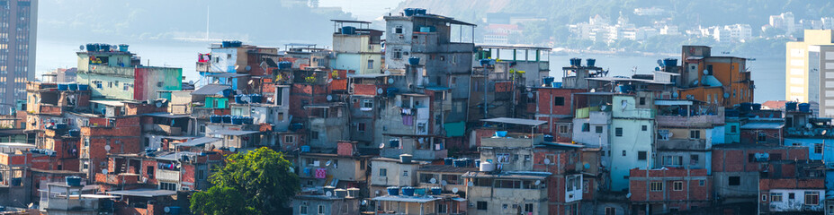Favelas in the city of Rio de Janeiro. A place where poor people live. - obrazy, fototapety, plakaty
