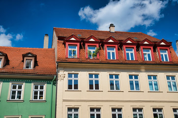 Fototapeta na wymiar Ancient medieval colourful buildings of Bamberg with blue sky on background, Germany