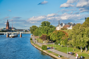Fototapeta na wymiar Frankfurt, Germany. City river and skyline on a summer afternoon