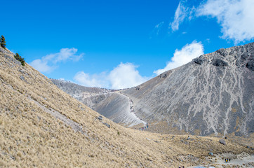Volcano hills filled with excursionists.