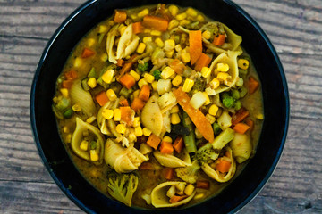 healthy plant-based food, mixed veggies pasta with vegan broth