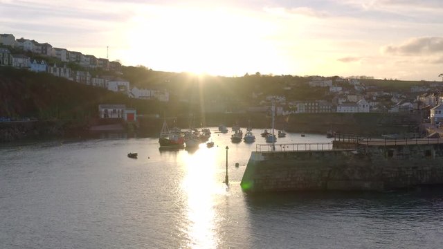 Boats in Mevagissey Harbour in Cornwall at Sunset