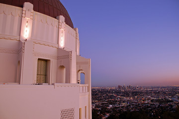 The Griffith Observatory begins to shine along with the lights of downtown Los Angeles