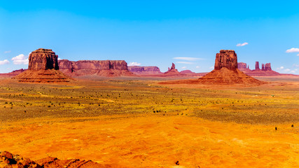 Merrick Butte, Mitten Buttes and Sentinel Mesa, massive Red Sandstone Buttes and Mesas in Monument Valley, a Navajo Tribal Park on the border of Utah and Arizona, United States