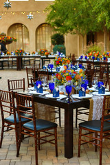 Outdoor dining setting for an event or wedding in a patio environment