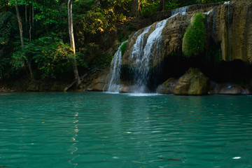 Fototapeta na wymiar small waterfall in the forest
