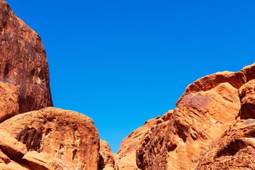 Amazing colors and shape of aztec sandstone rock formations in valley of fire state park under beautiful blue sky