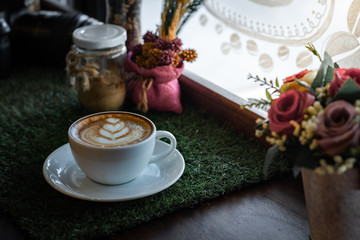 Hot coffee cup on a wooden table.
