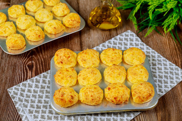 Baked cheese bread called chipa in baking tray.