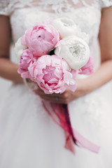 bride with a wedding bouquet