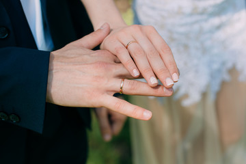 bride and groom holding their hands